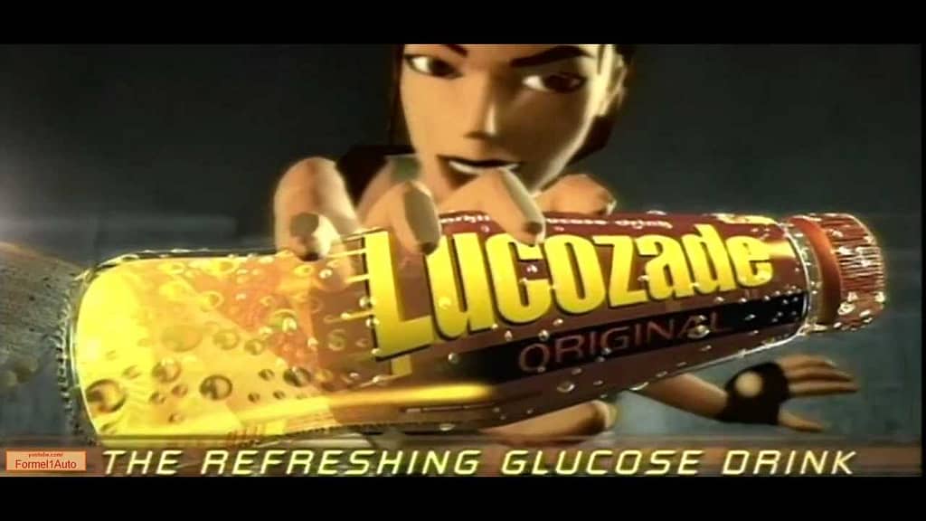 Image descriptor: An image from a Lucozade ad from the late 90s. Lara Croft is presenting a Lucozade Original bottle to the viewer, and the text at the bottom reads "The refreshing glucose drink"