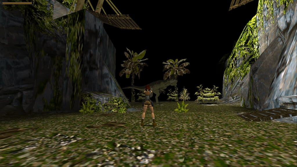 Image descriptor: Lara Croft can be seen pointing two handguns at a large T-Rex in the distance. They are in a large grassy valley, with a broken bridge hanging above; One of its pieces lying on the floor nearby.