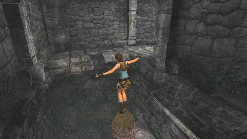Image Descriptor: Lara stretches her arms out to balance atop a thin wooden column, clearly intended to jump forwards to the cobblestone ledge ahead.