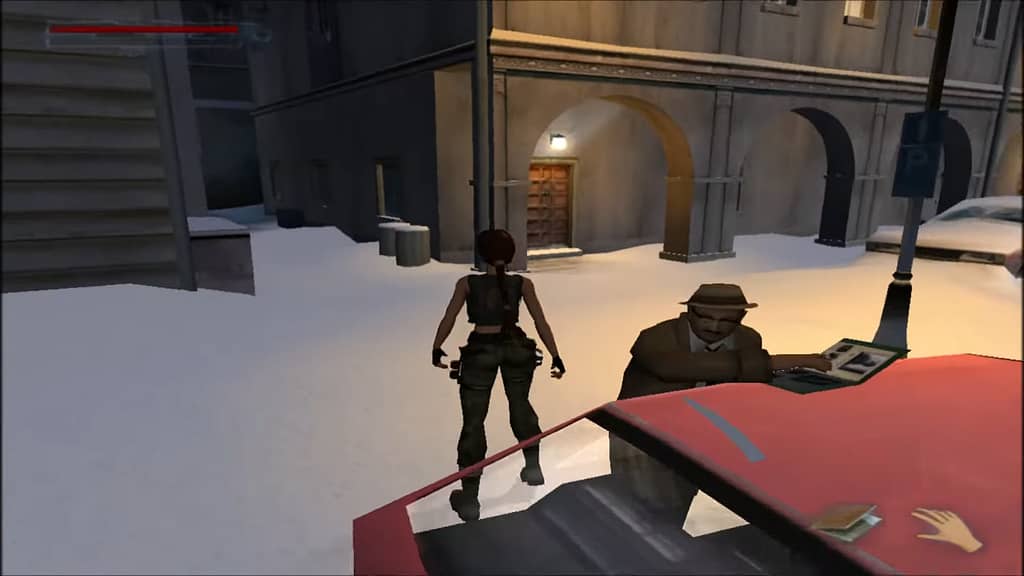 Image Descriptor: Lara stands with her back to a stereotypical private investigator, who is reading a case file which rests on top of a red car. The two of them are surrounded by snow, with a dark alleyway in the background.